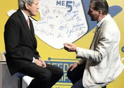Frank Zammataro shaking hands with Former Secretary of State John Kerry, 2018